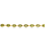 Yellow 14 Karat Oval Bezel Peridot Bracelet With A Lobster Claw Clasp