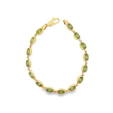 Yellow 14 Karat Oval Bezel Peridot Bracelet With A Lobster Claw Clasp