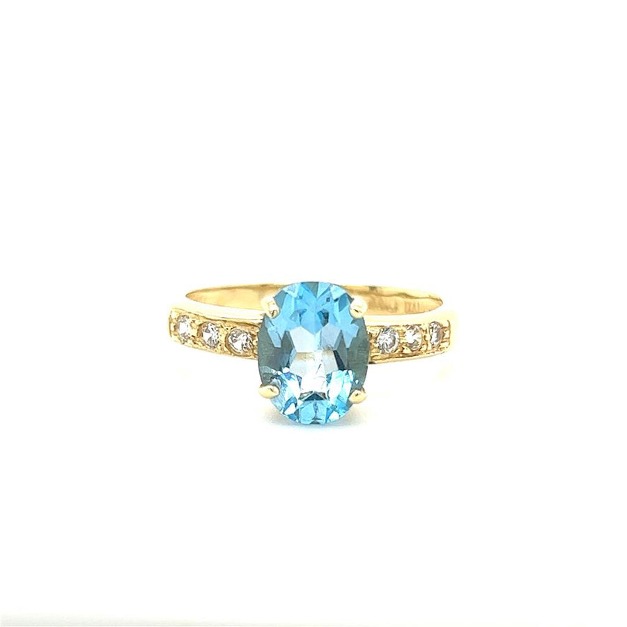 Estate Blue Topaz and Diamond Ring, 14KY, 2.7grams.
9x7 oval blue topaz, six 1.8mm czs.