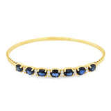 Yellow 14 Karat Bangle Bracelet 7 = 3.14TWT Oval Sapphires
12 = 0.22T